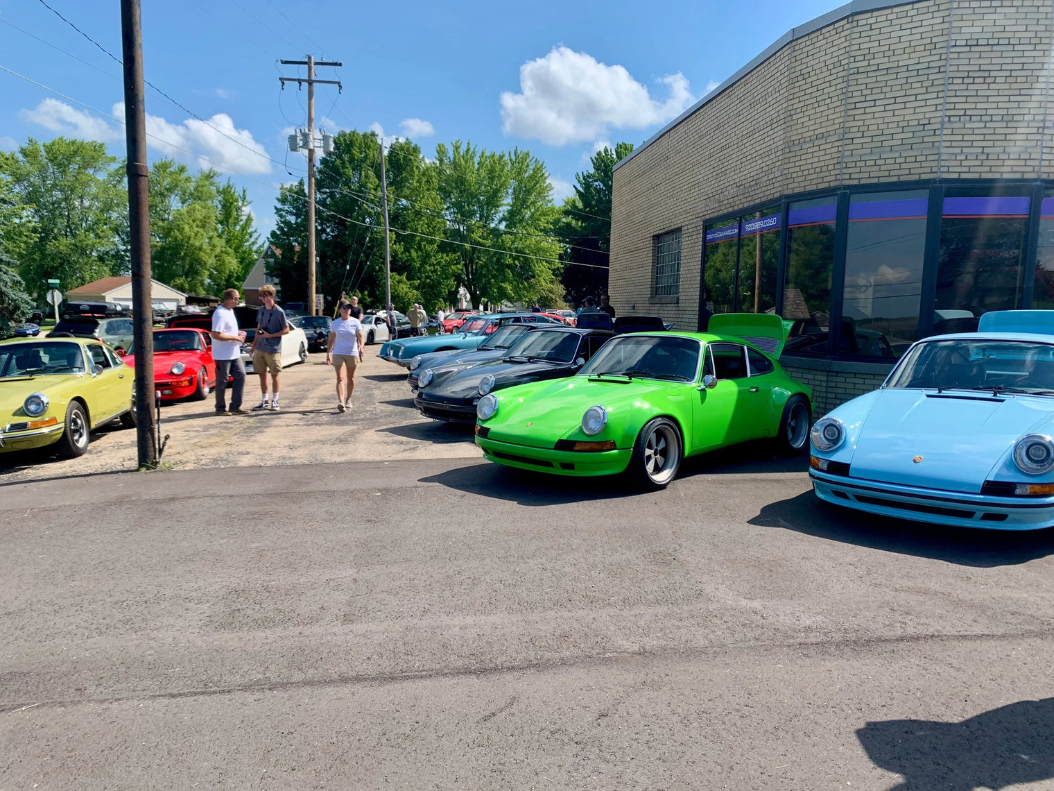 Vintage Porsche 911 cars at a summer car show