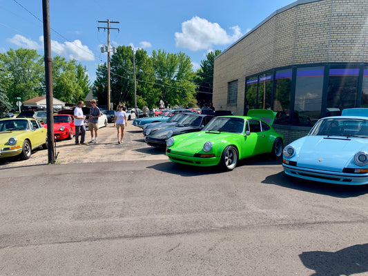 Vintage Porsche 911 cars at a summer car show