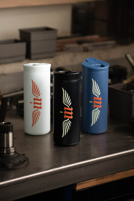Motovator travel mugs on a workbench