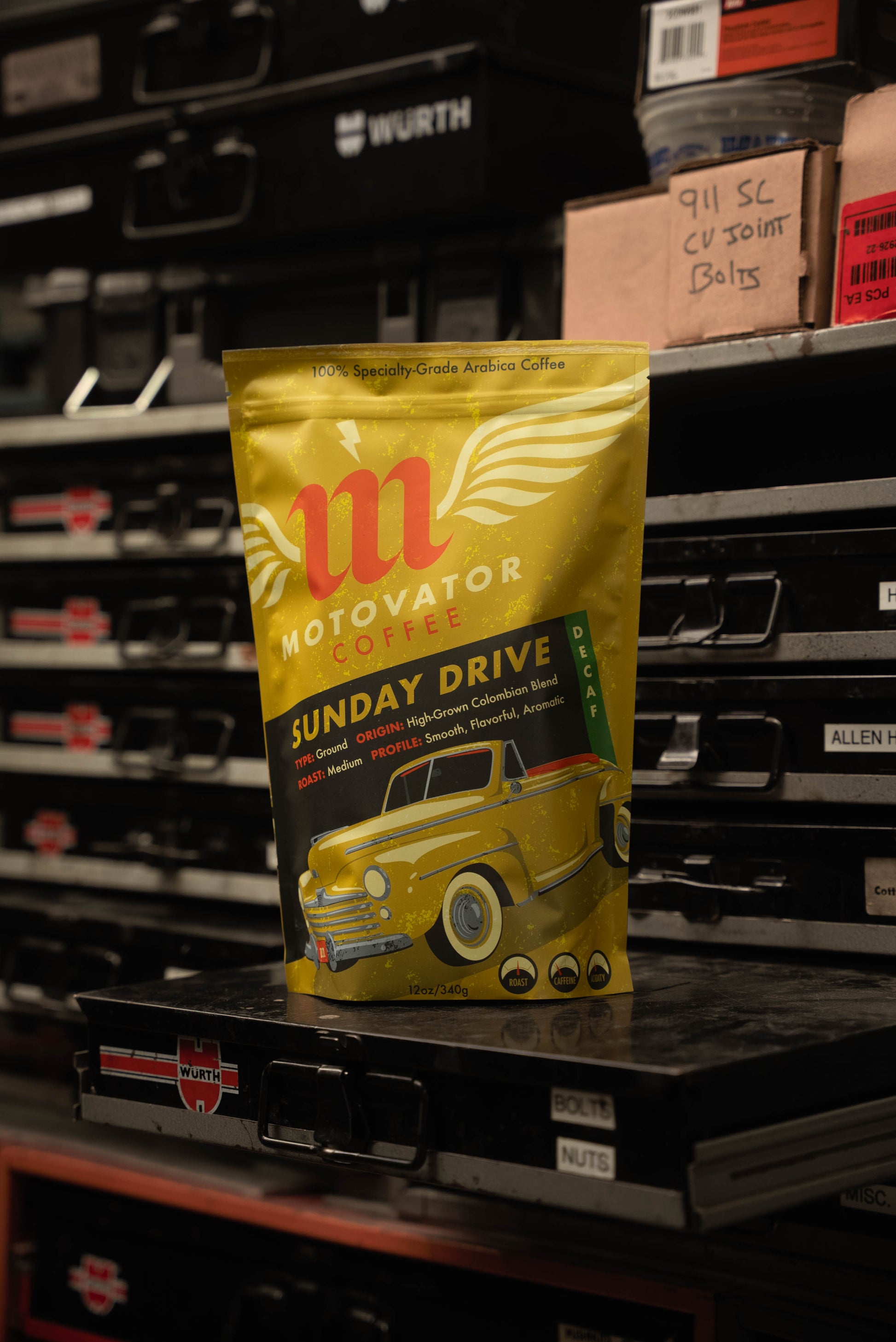 Motovator Decaf Coffee Bag on hardware shelf in an Automotive Workshop