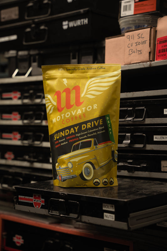 Motovator Decaf Coffee Bag on hardware shelf in an Automotive Workshop