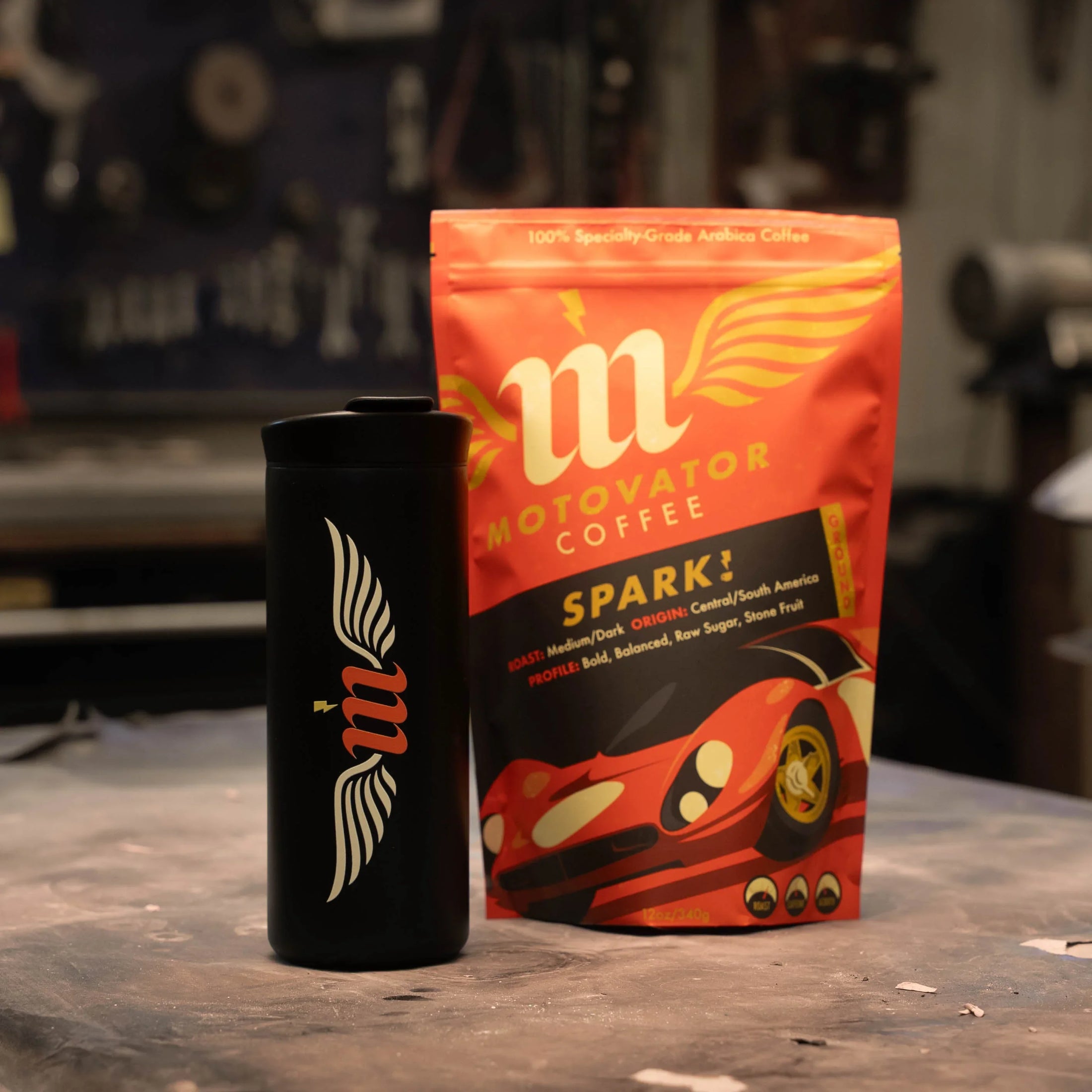 Motowater coffee package and mug on a workshop table