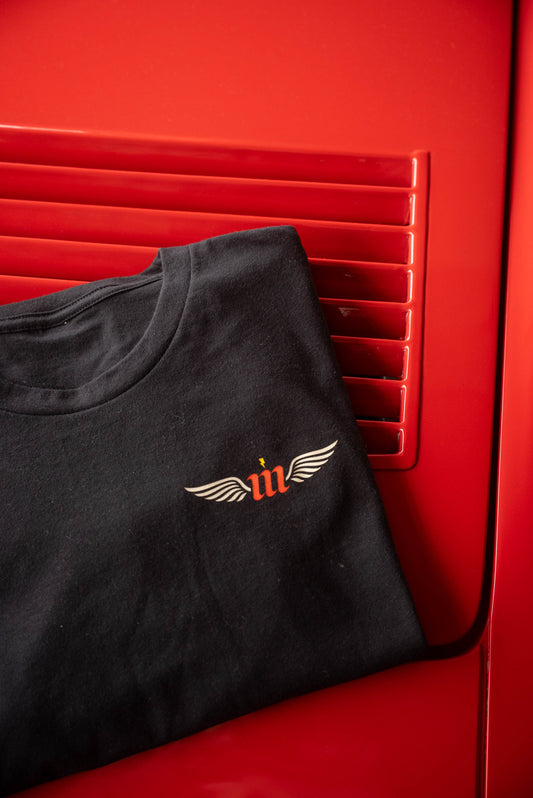 folded Motovator shirt on red Ferrari Hood