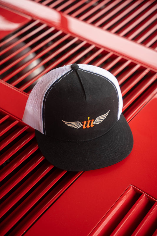Motovator logo trucker hat on red Ferrari engine vents